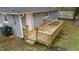 Wooden deck and exterior view of gray house at 509 Keith St, Knightdale, NC 27545