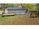 Gray house with wooden deck and storage shed at 509 Keith St, Knightdale, NC 27545