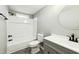 Updated bathroom with a bathtub, shower, and modern vanity at 509 Keith St, Knightdale, NC 27545