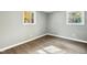 Bright bedroom with two windows and hardwood floors at 509 Keith St, Knightdale, NC 27545