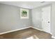 Cozy bedroom with a window and hardwood floors at 509 Keith St, Knightdale, NC 27545
