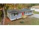 Newly renovated gray house with red door and landscaping at 509 Keith St, Knightdale, NC 27545