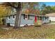 Newly renovated gray house with red door and landscaping at 509 Keith St, Knightdale, NC 27545