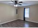 Spacious bedroom featuring a ceiling fan and large window at 803 Flat Rock Church Rd, Louisburg, NC 27549