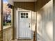 Front door with six-pane window and welcome sign at 1803 W W Davis St, Burlington, NC 27215