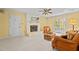 Cozy living room with fireplace, french doors, and a comfy wicker couch at 200 Trails End Ct, Raleigh, NC 27614