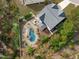 Aerial view of house, showcasing a backyard pool and surrounding landscape at 2200 Pollard Pl, Cary, NC 27519