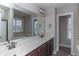 Double vanity bathroom with granite countertop and dark brown cabinets at 234 Silver Creek Dr, Clayton, NC 27520