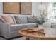 Gray sectional sofa with decorative pillows in a living room setting at 304 Leven Dr, Gibsonville, NC 27249