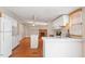 Kitchen with white cabinets, wood floors, and a breakfast bar at 336 N Raleigh Farms Rd, Youngsville, NC 27596