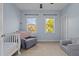 Bright bedroom with two windows and comfy seating at 4617 All Points View Way, Raleigh, NC 27614