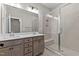 Bathroom with double vanity, large shower, and tile floors at 121 Pearl St # 4, Garner, NC 27529