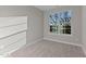 Bright bedroom featuring neutral walls and carpet at 121 Pearl St # 4, Garner, NC 27529