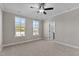 Bedroom with carpet, ceiling fan and access to bathroom at 121 Pearl St # 4, Garner, NC 27529