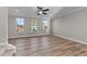Bright bonus room with hardwood floors and three windows at 121 Pearl St # 4, Garner, NC 27529