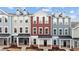 Three-story townhouses in a row, featuring a mix of gray and red siding at 121 Pearl St # 4, Garner, NC 27529