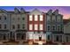 Three-story townhouses with brick and siding exteriors, showcasing a modern design at 121 Pearl St # 4, Garner, NC 27529
