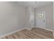 Bright foyer with light gray walls and wood-look flooring at 121 Pearl St # 4, Garner, NC 27529