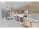 Modern kitchen with stainless steel appliances and light wood cabinets at 121 Pearl St # 4, Garner, NC 27529