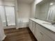 Modern bathroom with double vanity, soaking tub, and walk-in shower at 131 Tulipfield Way, Benson, NC 27504