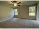 Bright bedroom with carpet and two large windows at 131 Tulipfield Way, Benson, NC 27504