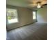 Spacious bedroom with neutral carpeting and large windows at 131 Tulipfield Way, Benson, NC 27504