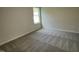 Well-lit bedroom with neutral walls and carpet flooring at 131 Tulipfield Way, Benson, NC 27504