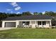 New construction home with a grey roof and a stone accent at 131 Tulipfield Way, Benson, NC 27504