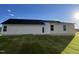 House exterior showcasing white siding and a patio at 131 Tulipfield Way, Benson, NC 27504
