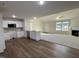 Open kitchen with breakfast bar and view to living room at 131 Tulipfield Way, Benson, NC 27504