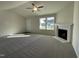 Spacious living room with a fireplace and high ceilings at 131 Tulipfield Way, Benson, NC 27504