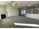 Open living room with a fireplace and kitchen view at 131 Tulipfield Way, Benson, NC 27504