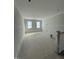 Unfinished basement with two windows, under construction at 2434 Field Poppy Dr # 161, Apex, NC 27502