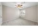 Well-lit bedroom featuring a ceiling fan and a window at 2510 Huntscroft Ln # 102, Raleigh, NC 27617