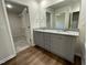 Bathroom with double vanity, granite countertop, and walk-in shower at 396 Magnolia Run Way, Benson, NC 27504