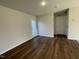 Bedroom with door to exterior and hardwood flooring at 396 Magnolia Run Way, Benson, NC 27504
