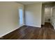 Bright bedroom with door leading to backyard and laundry room access at 396 Magnolia Run Way, Benson, NC 27504