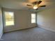 Spacious bedroom with two windows and carpeted floors at 396 Magnolia Run Way, Benson, NC 27504