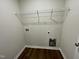 Laundry room with wire shelving and space for washer and dryer at 396 Magnolia Run Way, Benson, NC 27504