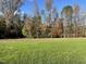Large lot with grassy area and mature trees at 396 Magnolia Run Way, Benson, NC 27504