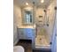 Updated bathroom with walk-in shower and modern vanity at 445 N Dunn St, Angier, NC 27501