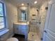 Updated bathroom with walk-in shower and modern vanity at 445 N Dunn St, Angier, NC 27501
