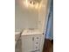 Modern bathroom with white vanity and hexagon tile floor at 445 N Dunn St, Angier, NC 27501