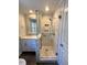 Updated bathroom with walk-in shower and modern vanity at 445 N Dunn St, Angier, NC 27501
