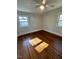 Spacious bedroom with hardwood floors and large windows at 445 N Dunn St, Angier, NC 27501