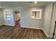 Bright dining area with built-in shelving and brick accent wall at 445 N Dunn St, Angier, NC 27501