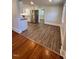 Open concept dining area with wood and tile flooring at 445 N Dunn St, Angier, NC 27501