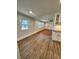 Open dining area with wood-look floors and kitchen views at 445 N Dunn St, Angier, NC 27501
