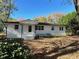 White Ranch style home with mature landscaping and large yard at 445 N Dunn St, Angier, NC 27501