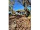 Attractive white house with large yard and mature trees at 445 N Dunn St, Angier, NC 27501